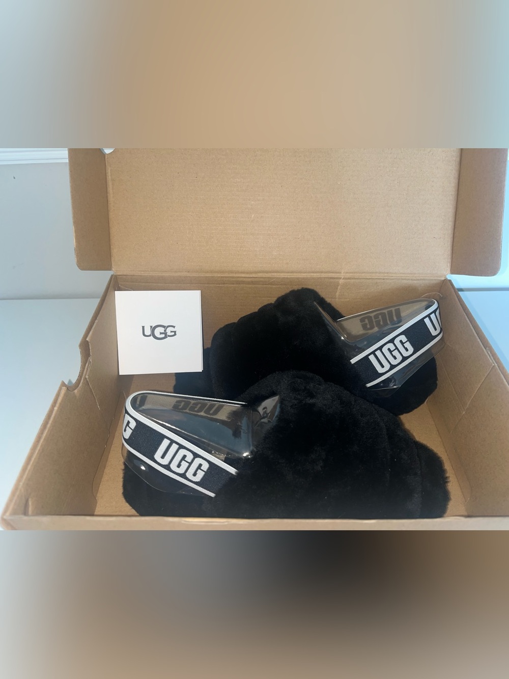UGG Black Fluffy Slide Slippers with Logo Heel Strap